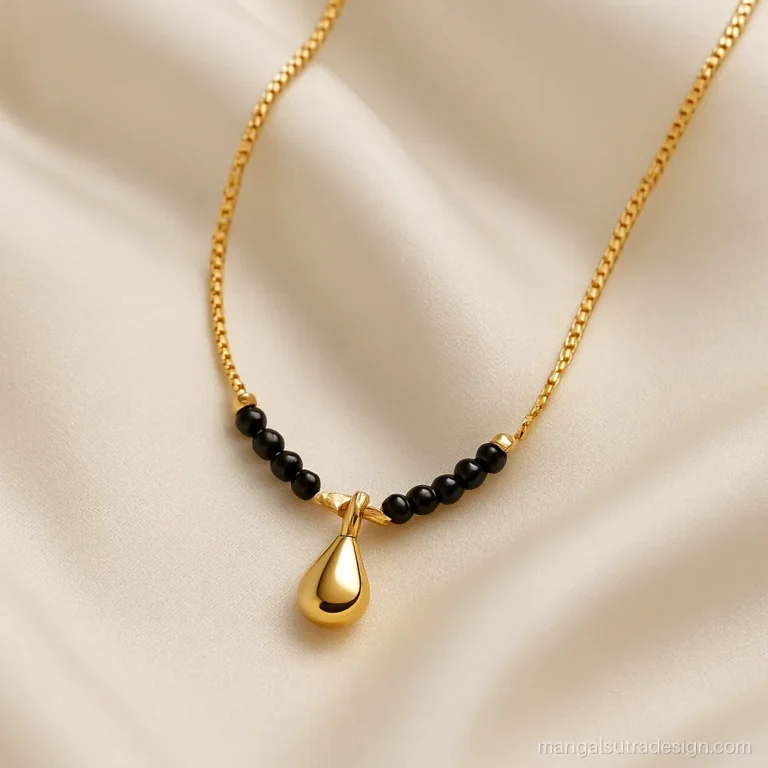 10 gram mini mangalsutra design with a strong gold chain and a small drop pendant