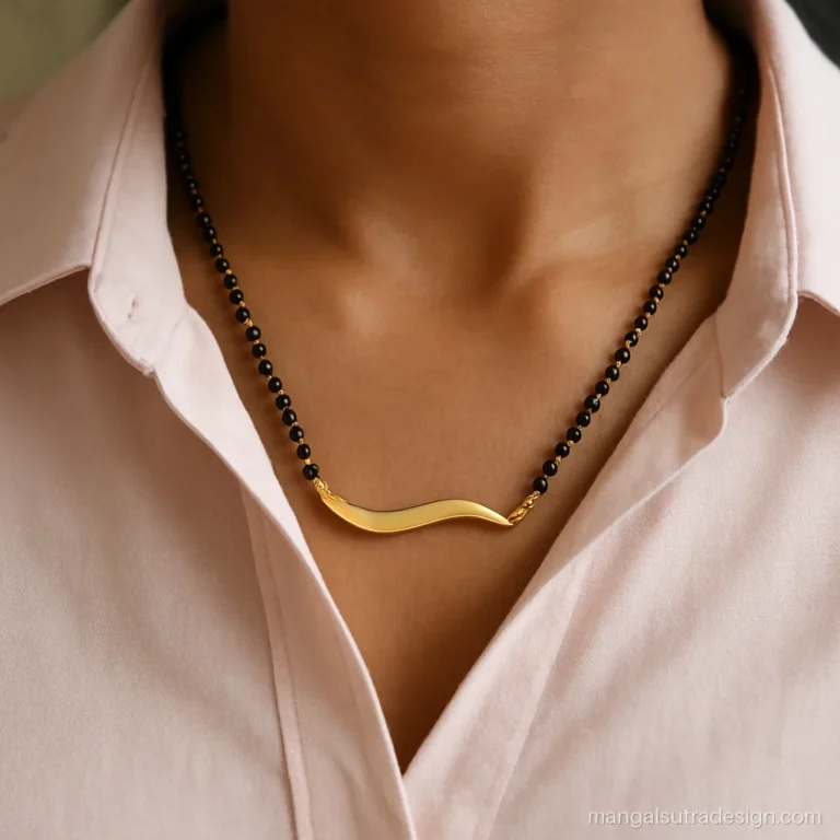 Modern gold mangalsutra with a 25 mm wave shaped bar on a double black bead strand