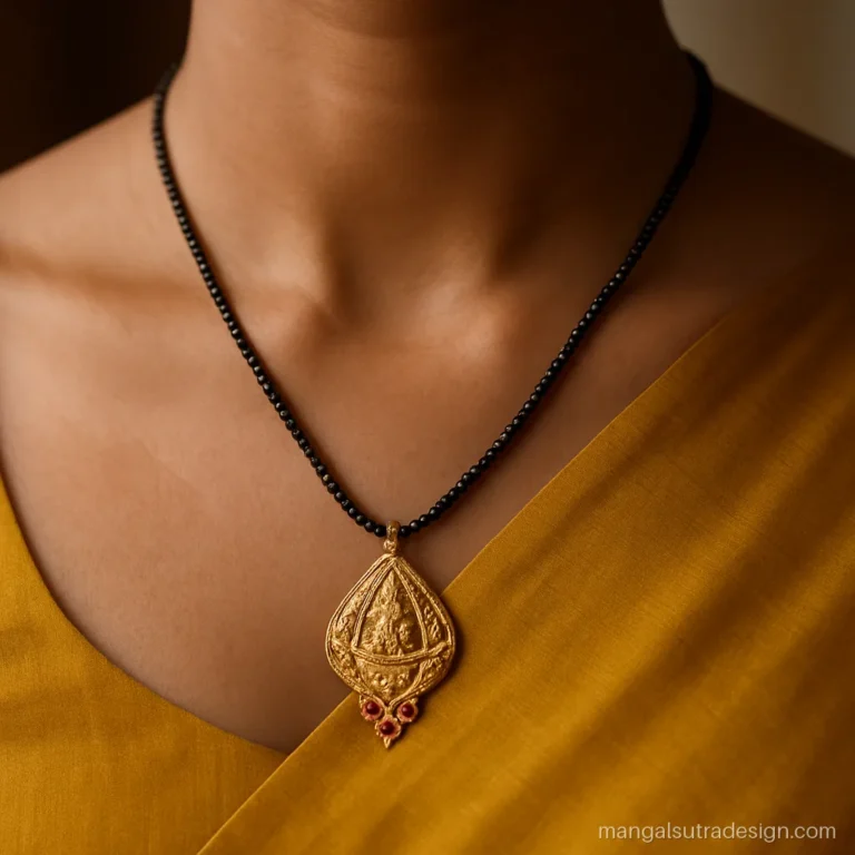 22k gold 10 gram gold mangalsutra pendant in a keri shape with temple carving