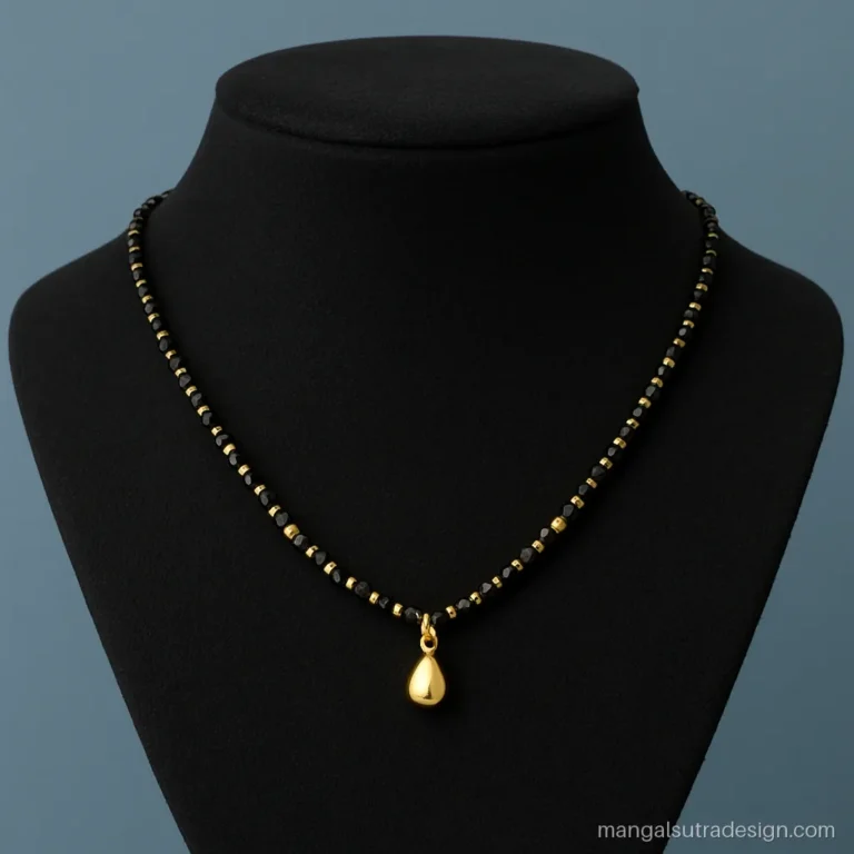 Full 4 gram gold mangalsutra with gold beads along the strand and a small drop pendant