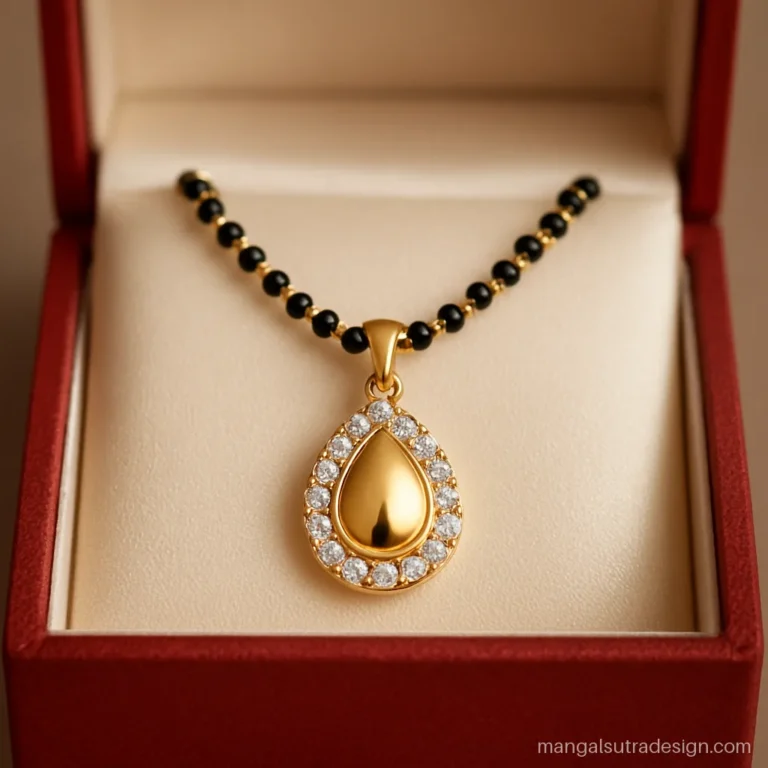 5 gram mangalsutra pendant with a teardrop shape and a halo of small white stones