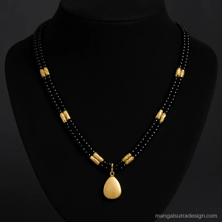 Black beads mangalsutra 22k gold with diamond cut barrel beads and a teardrop