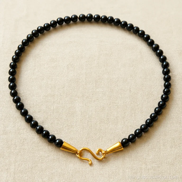 Only black beads mangalsutra strand with plain gold end caps and hook clasp