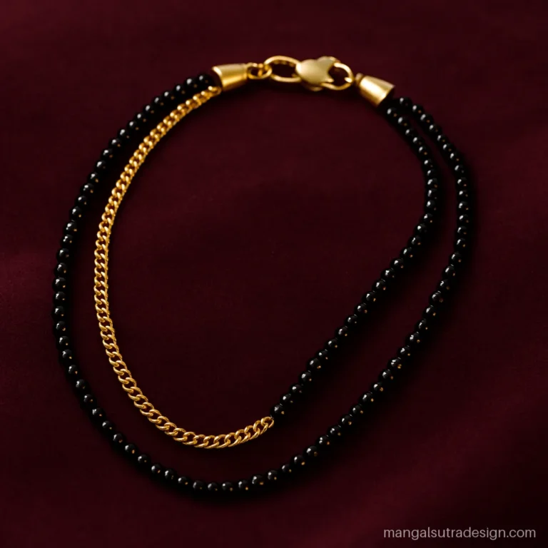 Double chain mangalsutra with one gold link line and one black bead line joined at a clasp