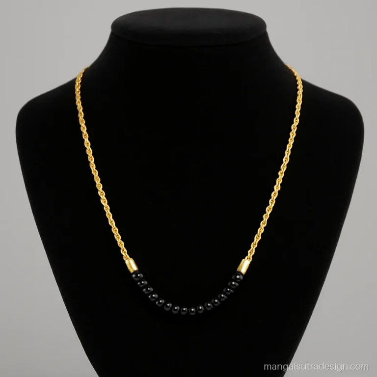 Gold chain mangalsutra design with a twisted rope chain and long black bead runs