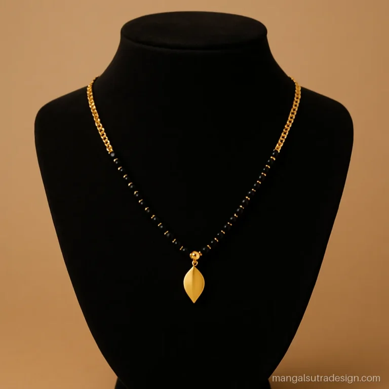 Women's gold mangalsutra design with black beads at front and curb chain at back