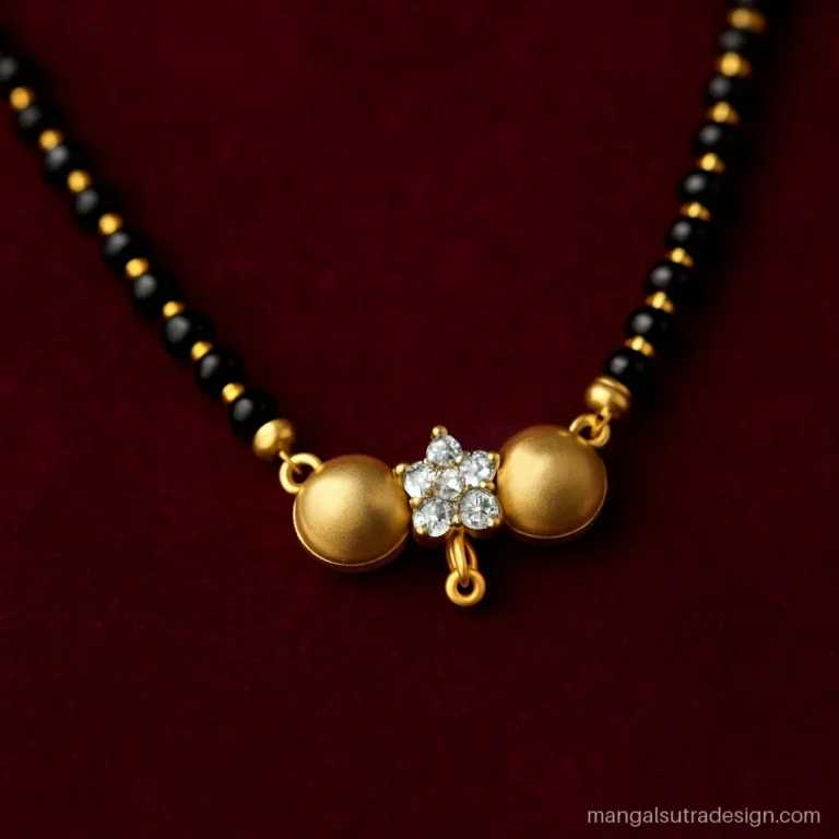 Gold mangalsutra with twin vati cups and a diamond flower set between them