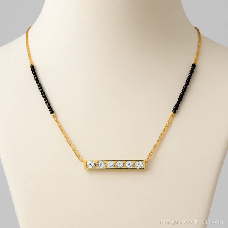 Gold mangalsutra with a straight bar pendant set with a line of five diamonds