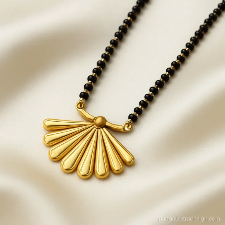 New mangalsutra design with a half circle fan pendant of gold petals