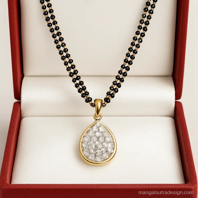 Long mangalsutra with a pear shaped diamond cluster pendant on a double black bead strand