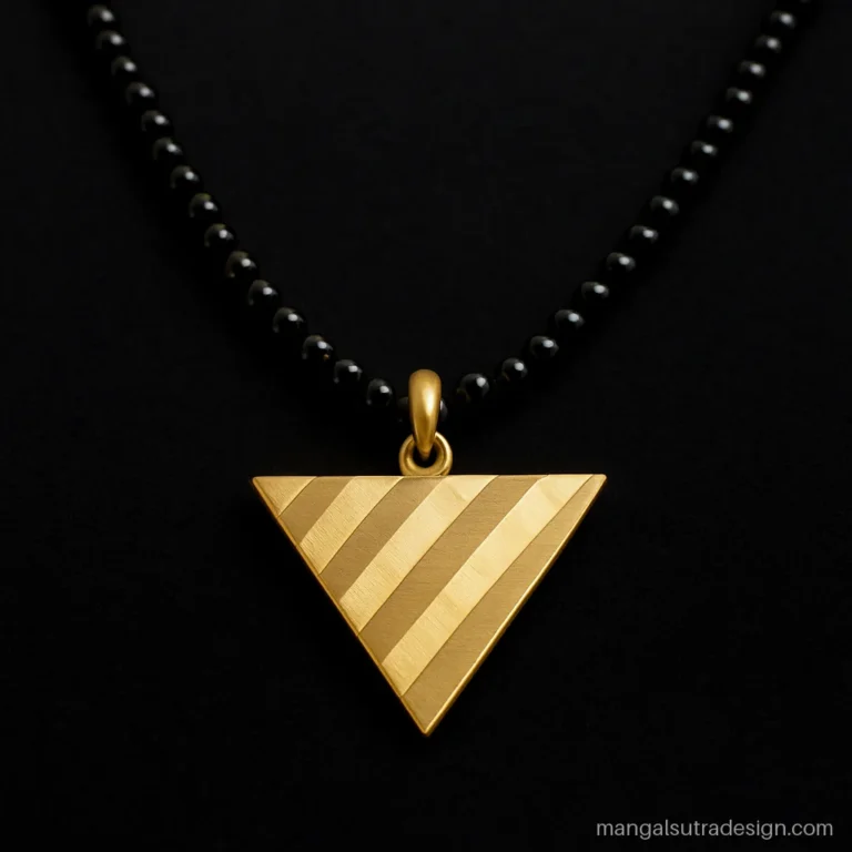 Latest long mangalsutra design with a big gold triangle in brushed and polished stripes