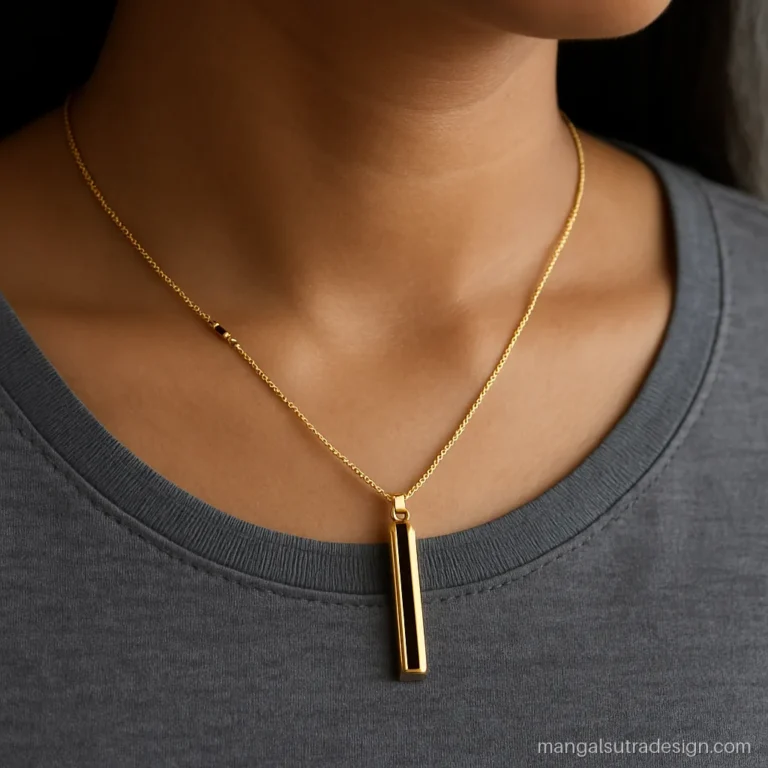 Minimal modern mangalsutra with a vertical gold bar and black enamel stripe