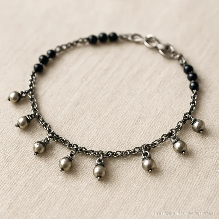 Silver mangalsutra bracelet with oxidised finish and tiny ghungroo bells