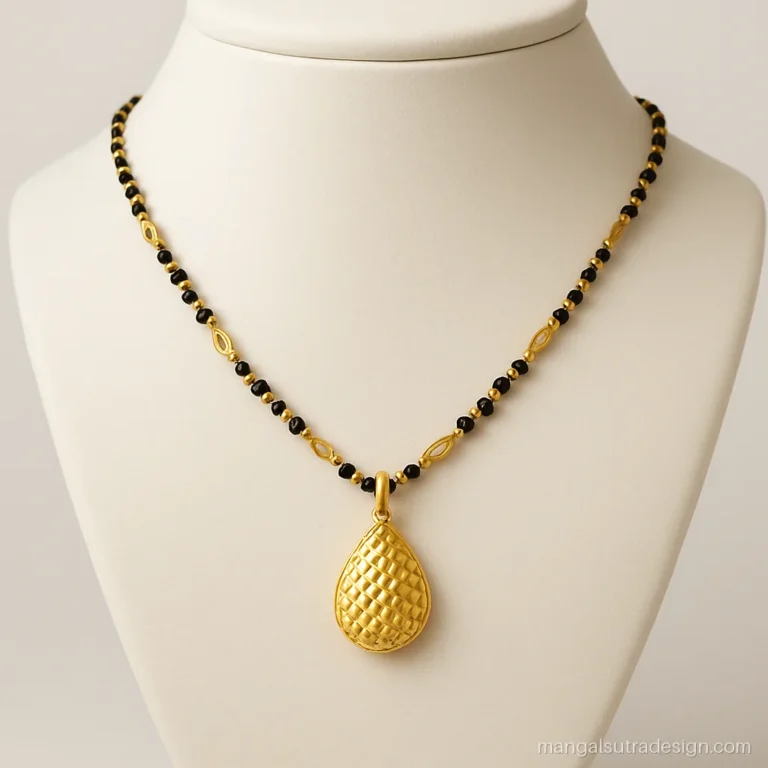 Gujarati mangalsutra with a diamond cut gold pendant on a gold and black bead chain