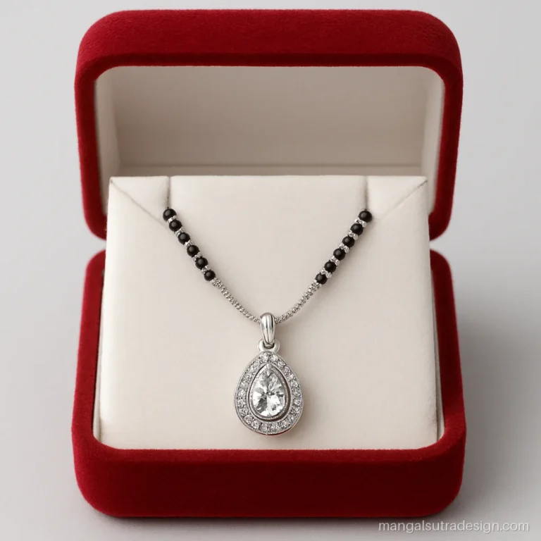 Silver mangalsutra design with a teardrop CZ pendant on a fine black bead chain