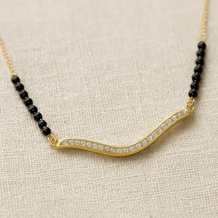 18 carat gold mangalsutra with a wavy bar pendant lined with tiny diamonds