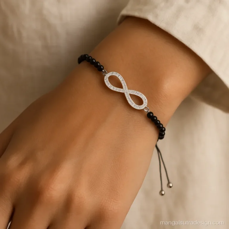 Silver mangalsutra bracelet with an infinity bar and a sliding adjustable clasp