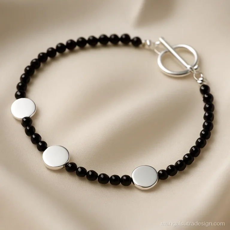 Mangalsutra silver bracelet with three small discs and a toggle clasp on black beads