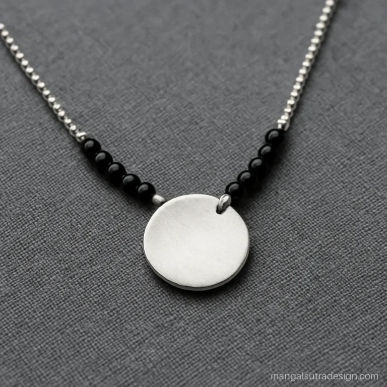 925 silver mangalsutra with a brushed round disc on a ball chain and black beads