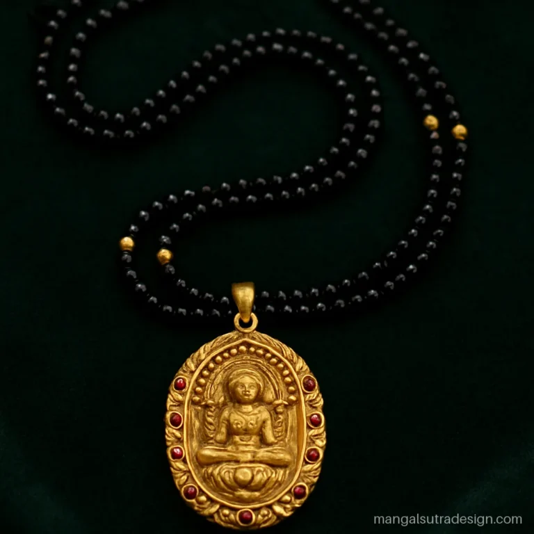 Traditional mangalsutra with an antique gold temple pendant showing a seated goddess figure